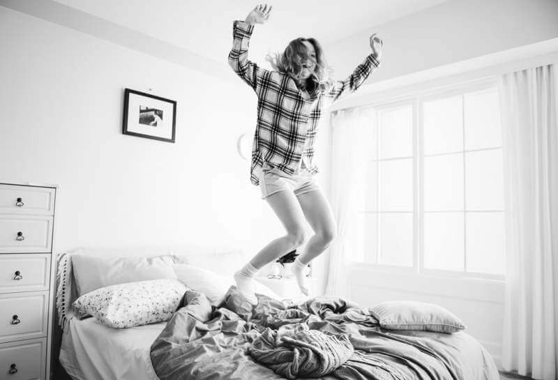Young happy women jumping