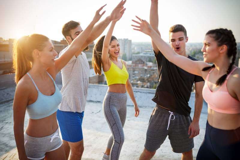 group-of-young-happy-people-friends-exercising