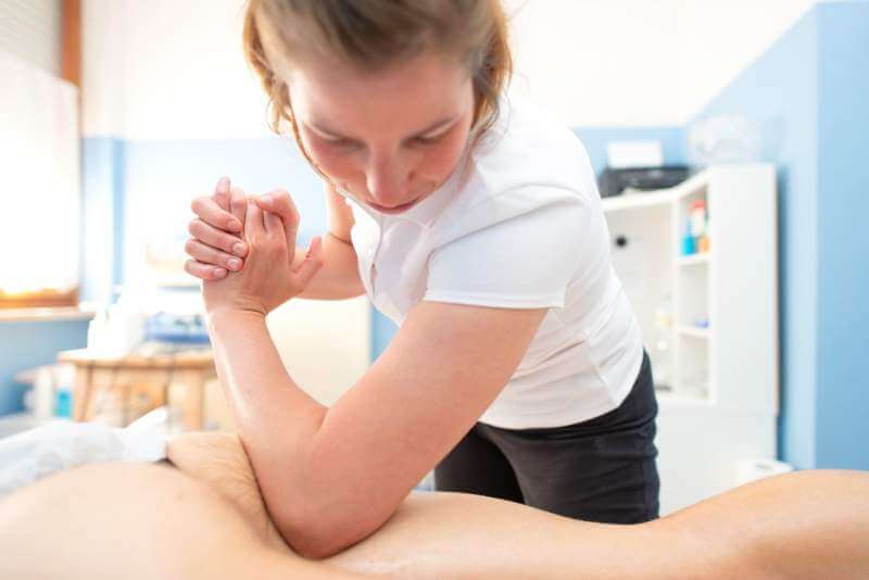 physiotherapist-performs-deep-and-de-contracting