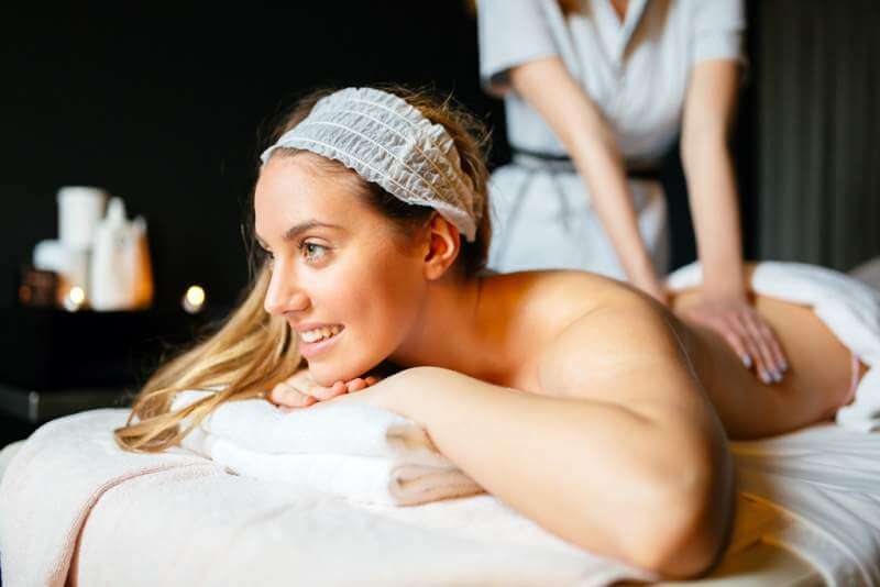 massage-therapist-massaging-woman
