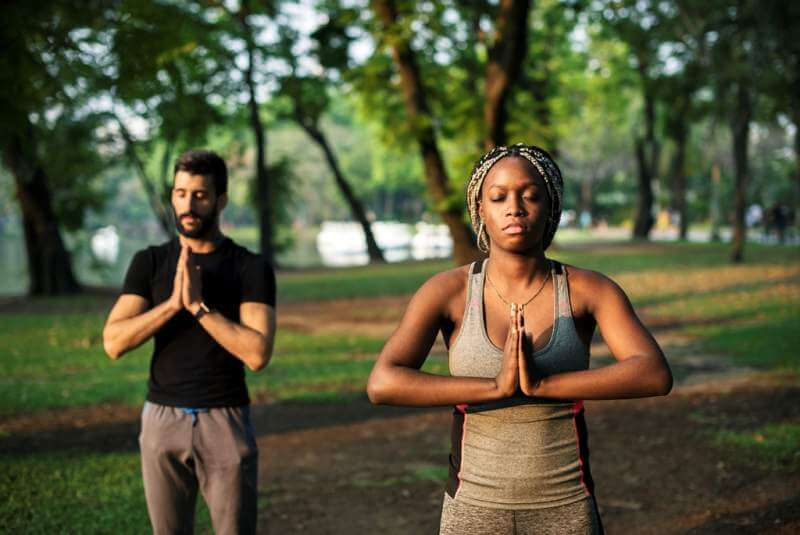 people-yoga-in-a-park