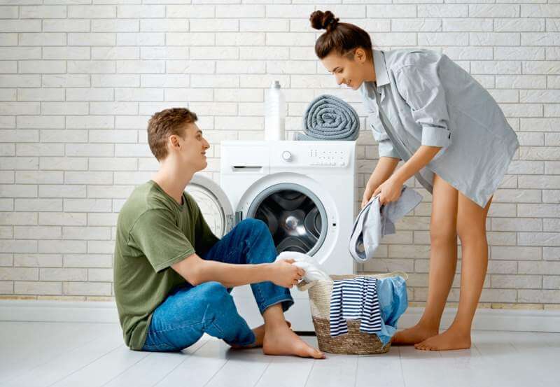 loving-couple-is-doing-laundry