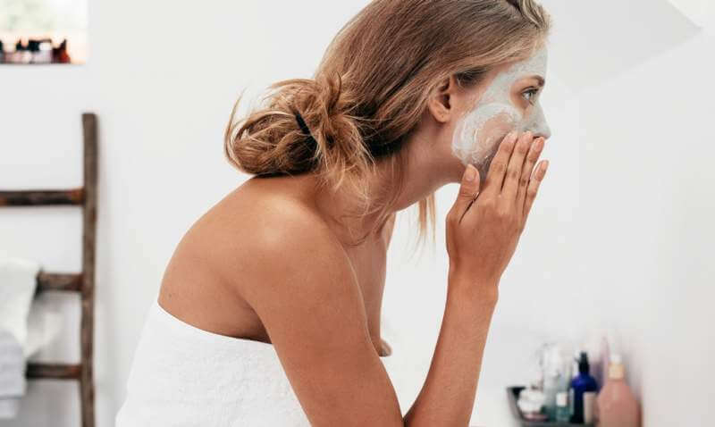 woman-taking-care-of-her-facial-skin