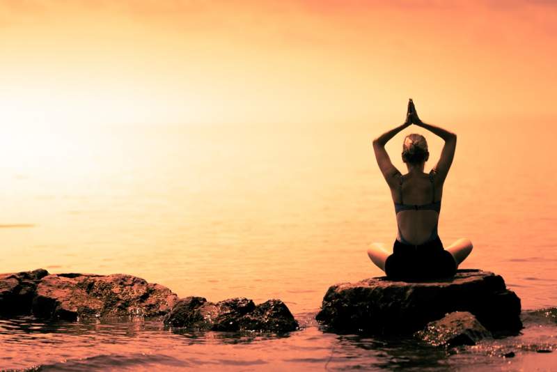 young-woman-doing-lotus-yoga-position-in-front