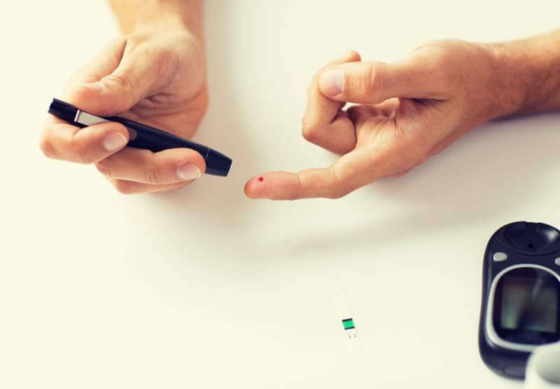 close-up-of-man-checking-blood-sugar