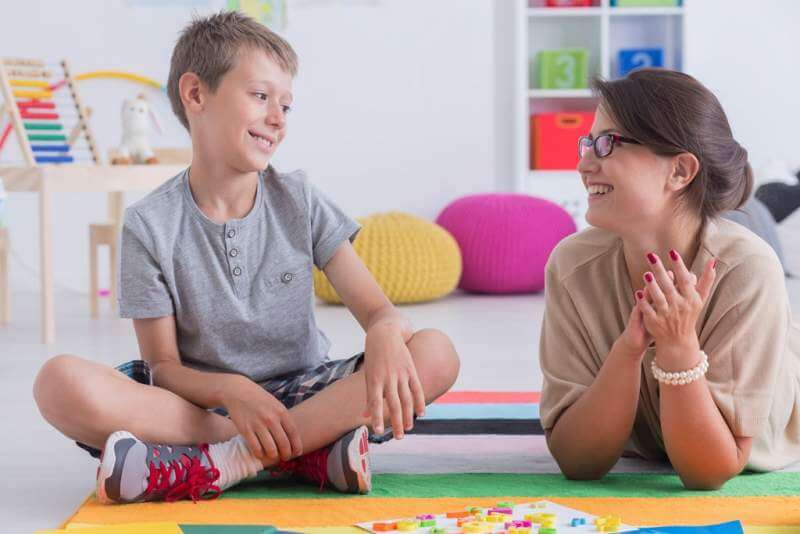 happy-child-and-school-counselor Speech Therapy for Autism?