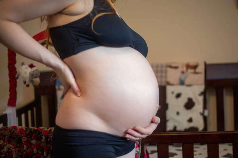pregnant-woman-holding-her-belly